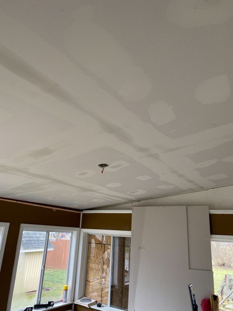 A room with a ceiling that is being remodeled.