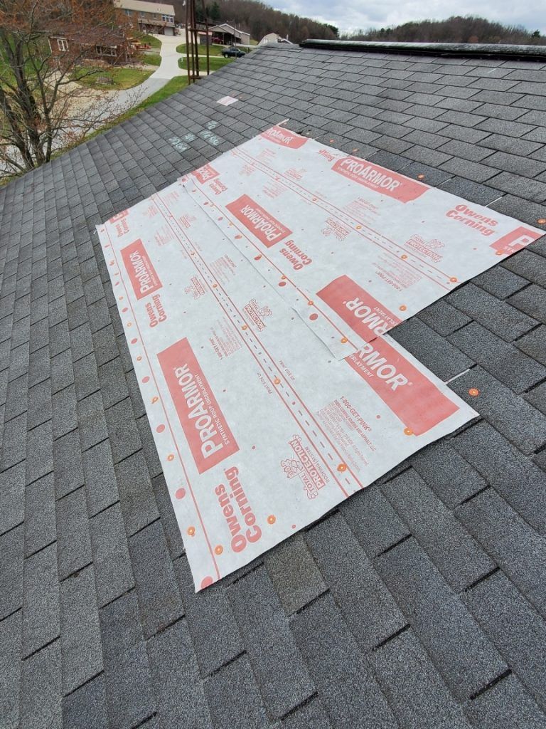 A piece of paper is lying on top of a roof.