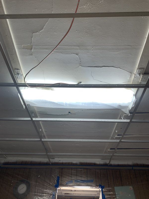 A light fixture is hanging from the ceiling of a room.