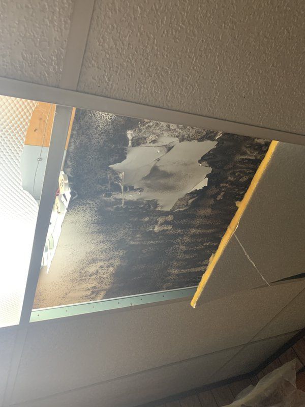 A picture of a damaged ceiling.