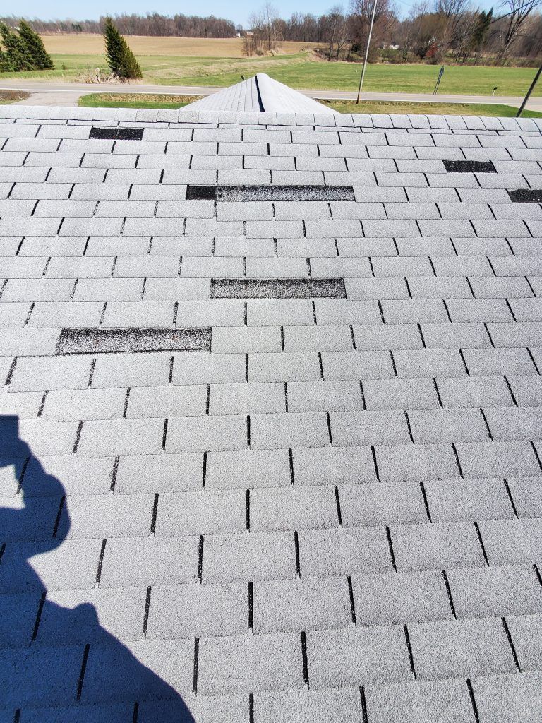 A roof with shingles.