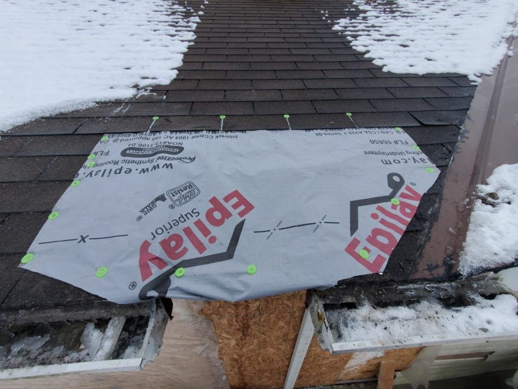A roof in the process of being repaired.