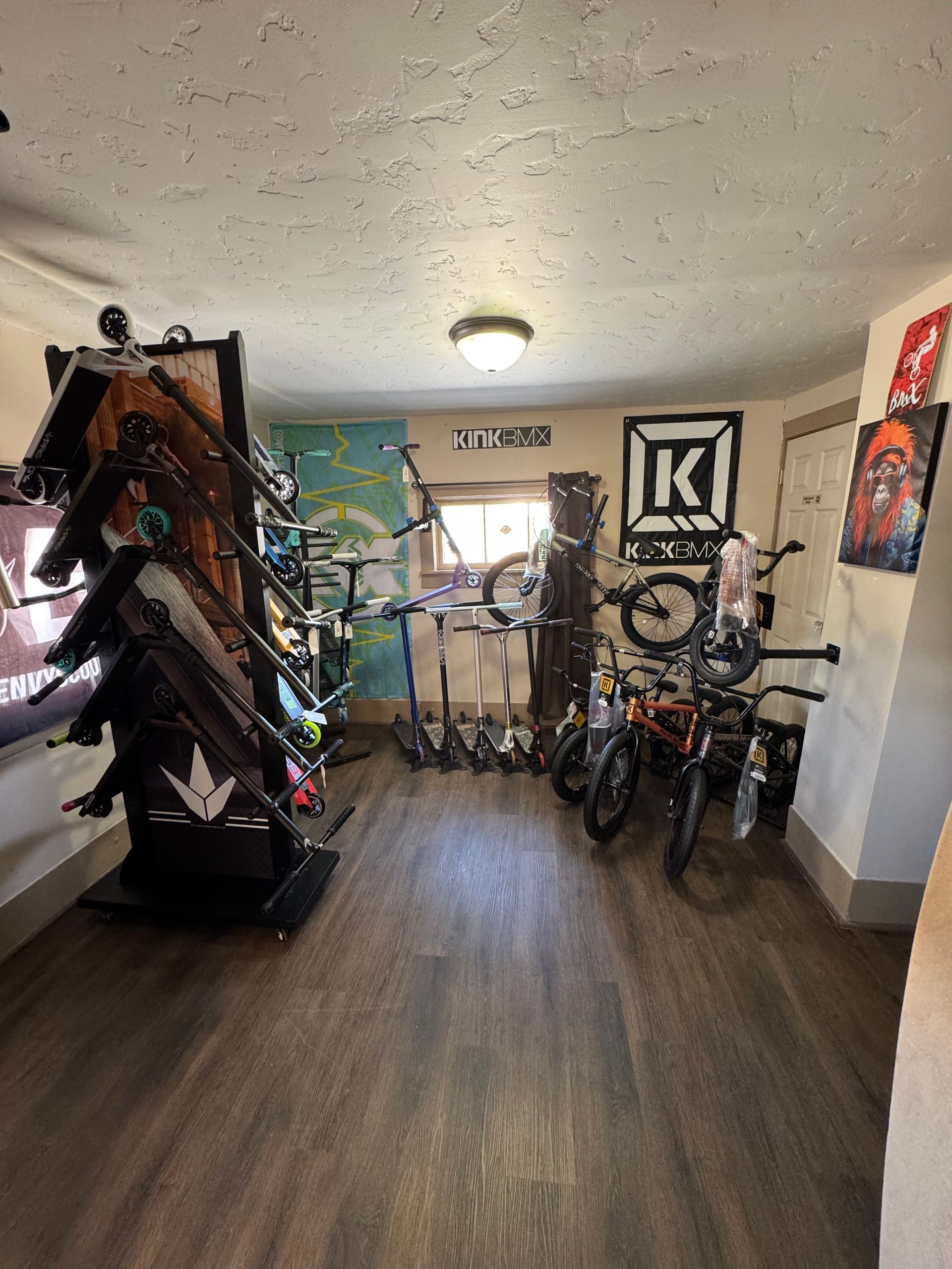 A room filled with lots of bikes and scooters.