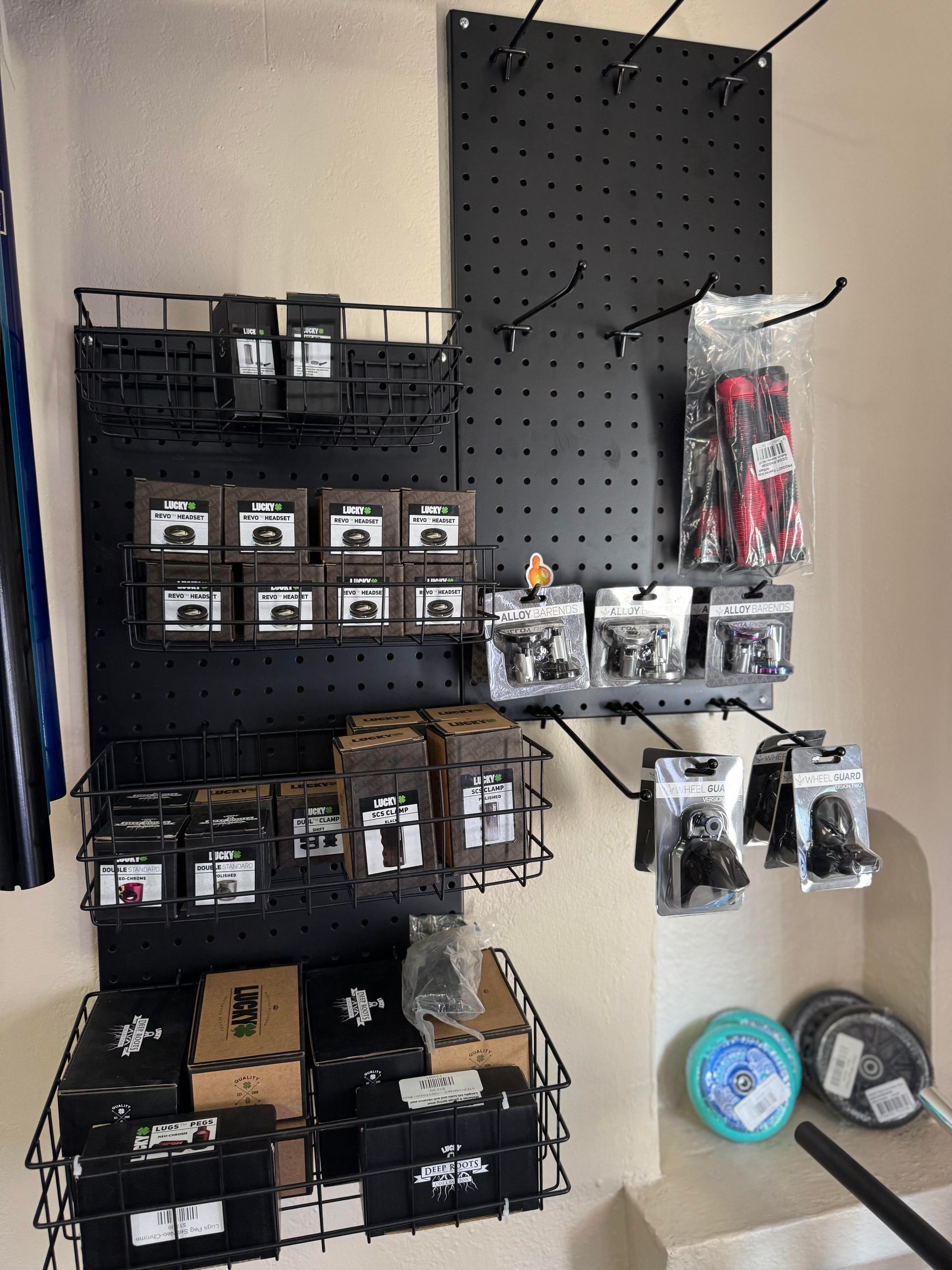 A powell peralta sign hangs above a display of skateboards