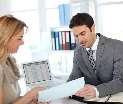 Pretty young woman explaining about her profile to business manager