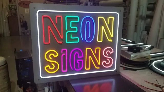 A neon sign that says neon signs on it