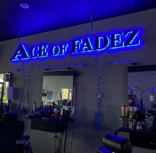 A barber shop with a sign that says ace of fadez
