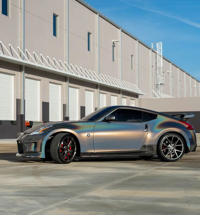 A sports car is parked in front of a building