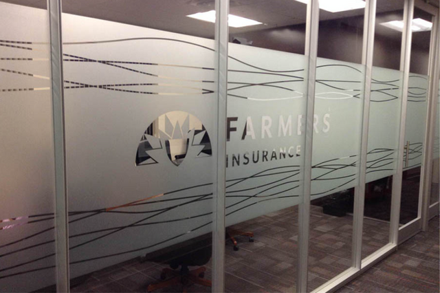 A window with a farmers insurance logo on it