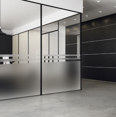 A room with a glass wall and black walls