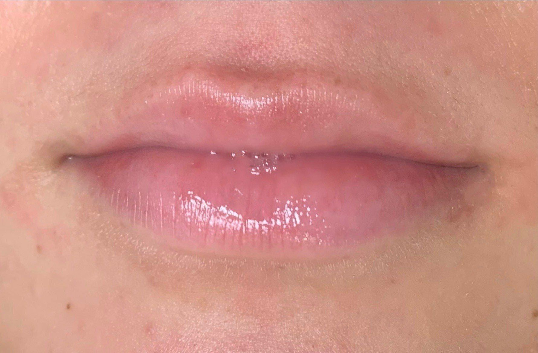 A close up of a person 's lips in a black and white photo.