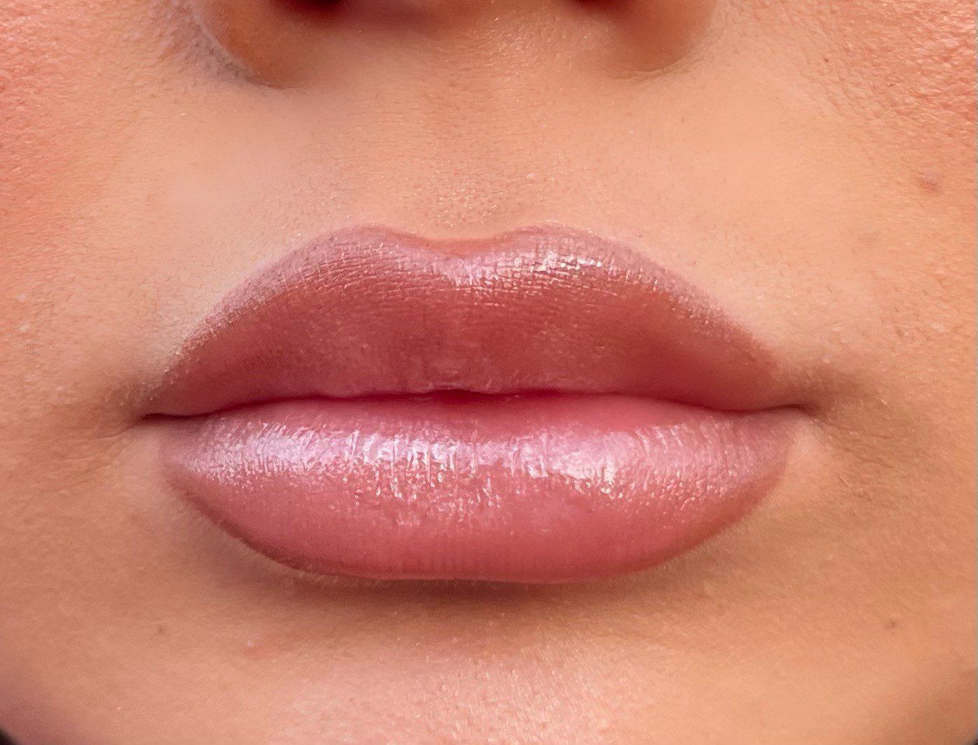 A close up of a woman 's lips in a black and white photo.