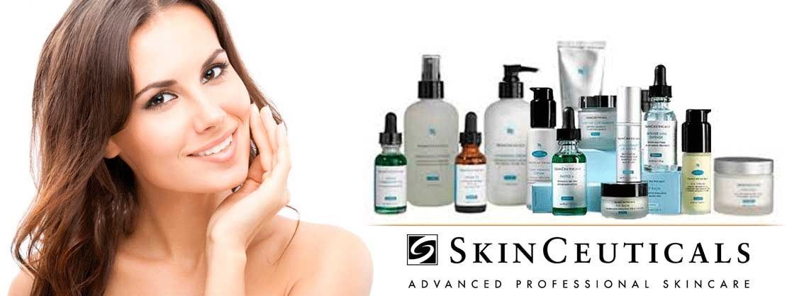 A woman is smiling in front of a banner for skinceuticals