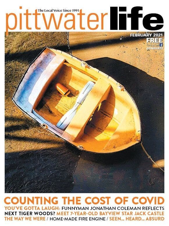 Magazine cover: An empty yellow rowboat on sandy ground. Title: 