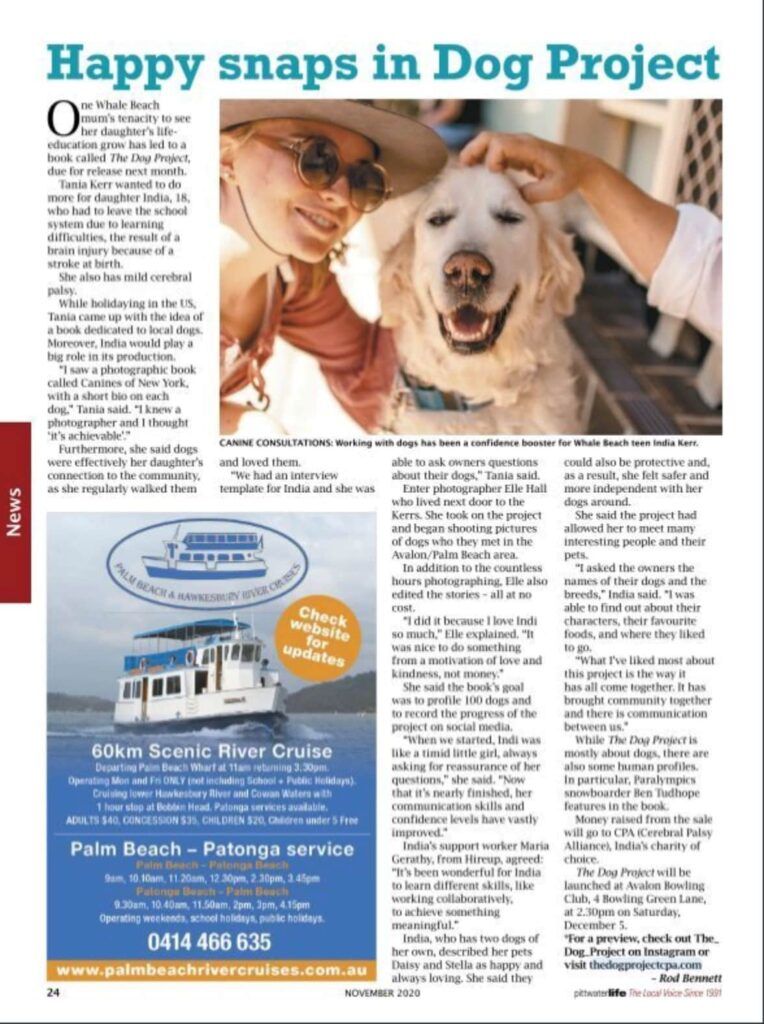 Woman petting a happy, light-colored dog, both smiling in an outdoor setting.