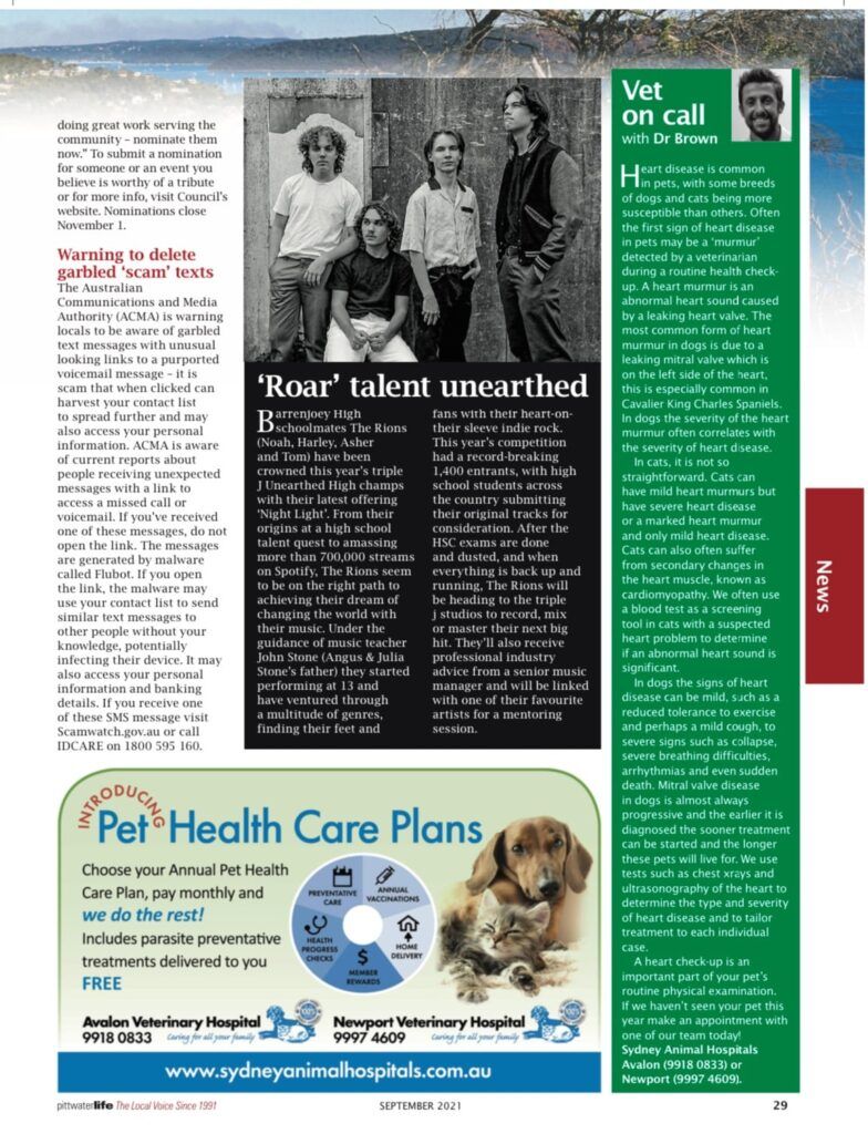 Band poses in front of wooden wall. Two standing, two seated. Text: 