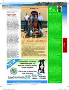 People with a beach wheelchair in front of a building; newspaper clipping.