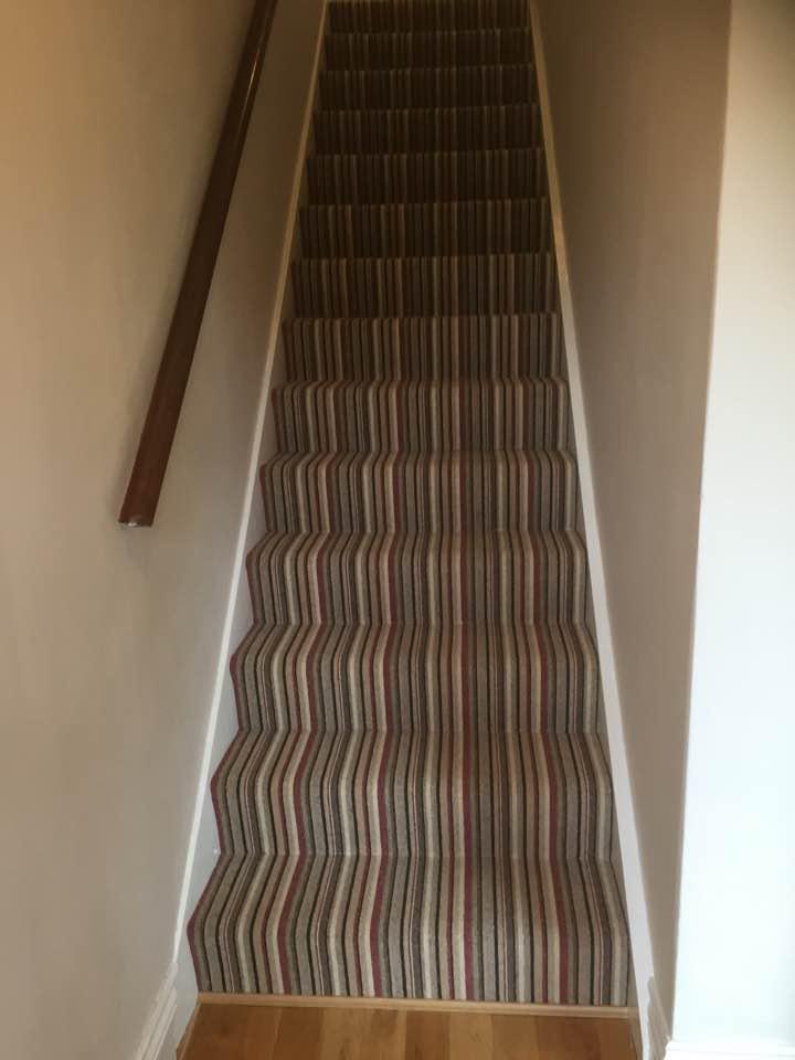 Domestic striped stair case carpet