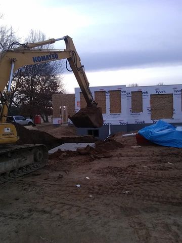 Heavy duty excavator working on ground — White Pigeon, MI — Mercers Septic & Excavating LLC