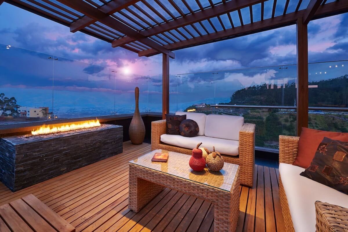 A patio with a fire pit and a couch and table — Nicho's Home Maintenance In Tamworth, NSW