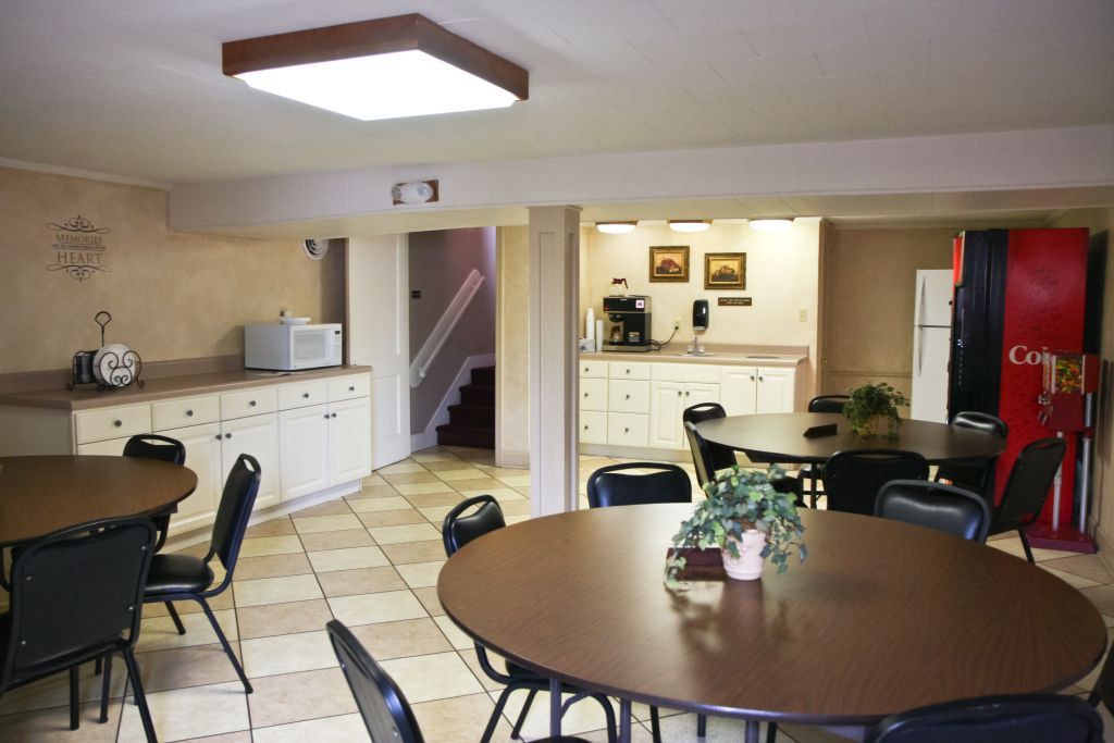 Lounge area with tables and a vending machine