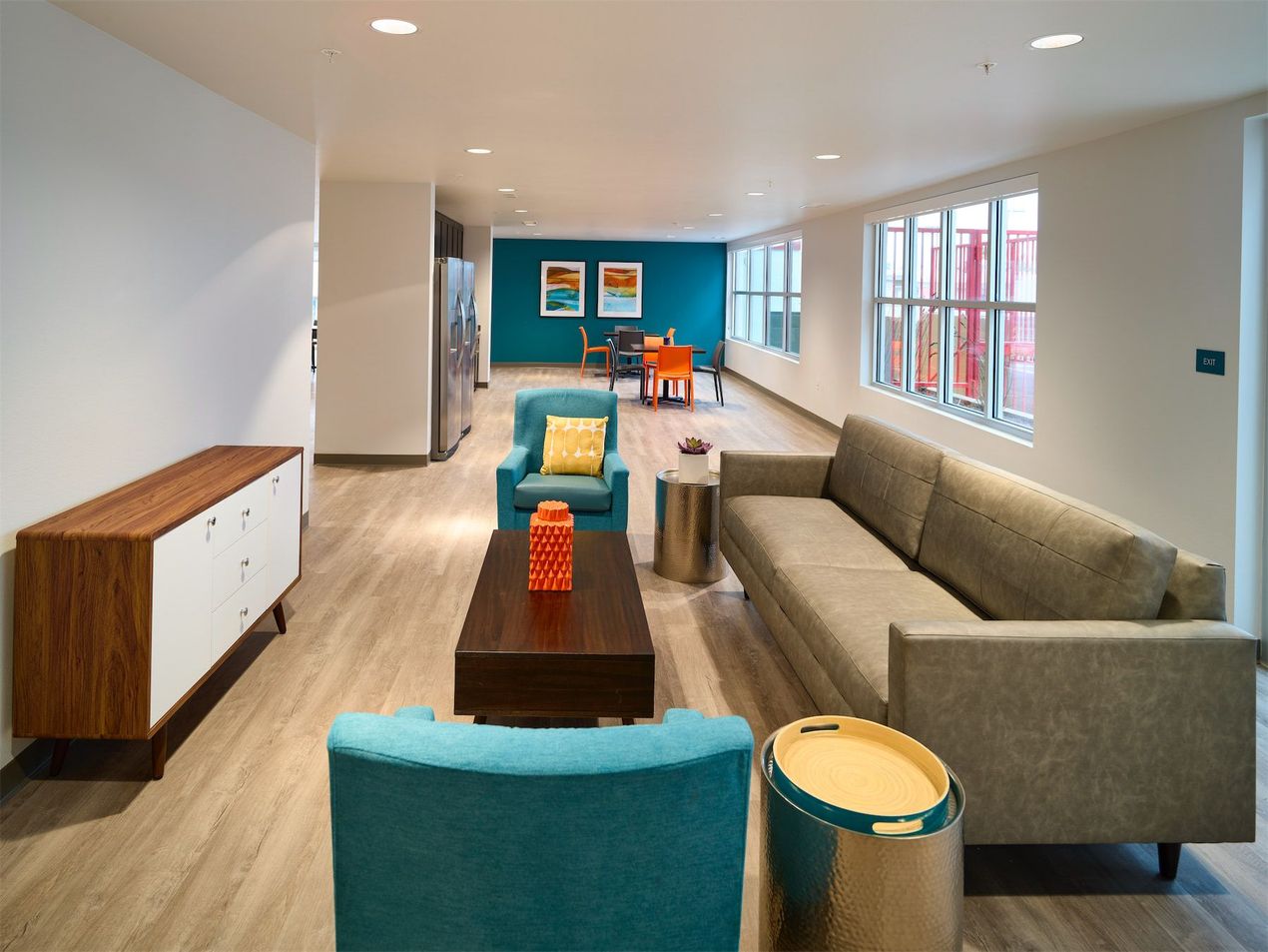 a living room with a couch , chairs and a coffee table