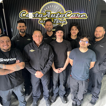 Seven people posing in front of a C&A Auto Care Tire shop sign. | Costa Auto Care and TIre