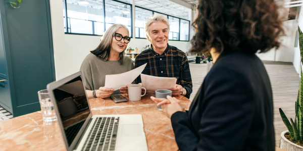 couple talking to insurance agent about life insurance