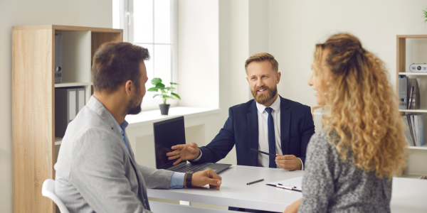 insurance agent going over insurance plans with customers