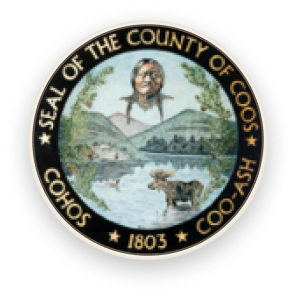 Seal of Coos County, New Hampshire. Portrait of Native American, mountains, lake, moose, and text.