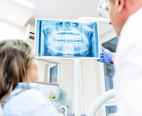 Patient and Dentist review dental X-rays in Land O' Lakes FL