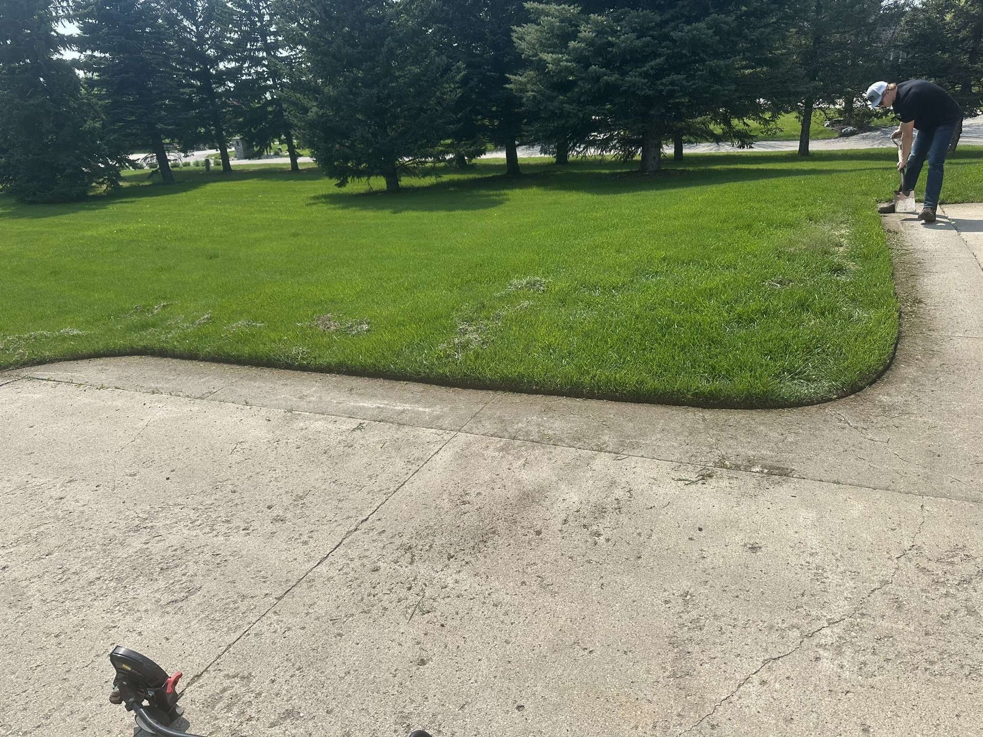 A person is walking a dog on a leash in a park