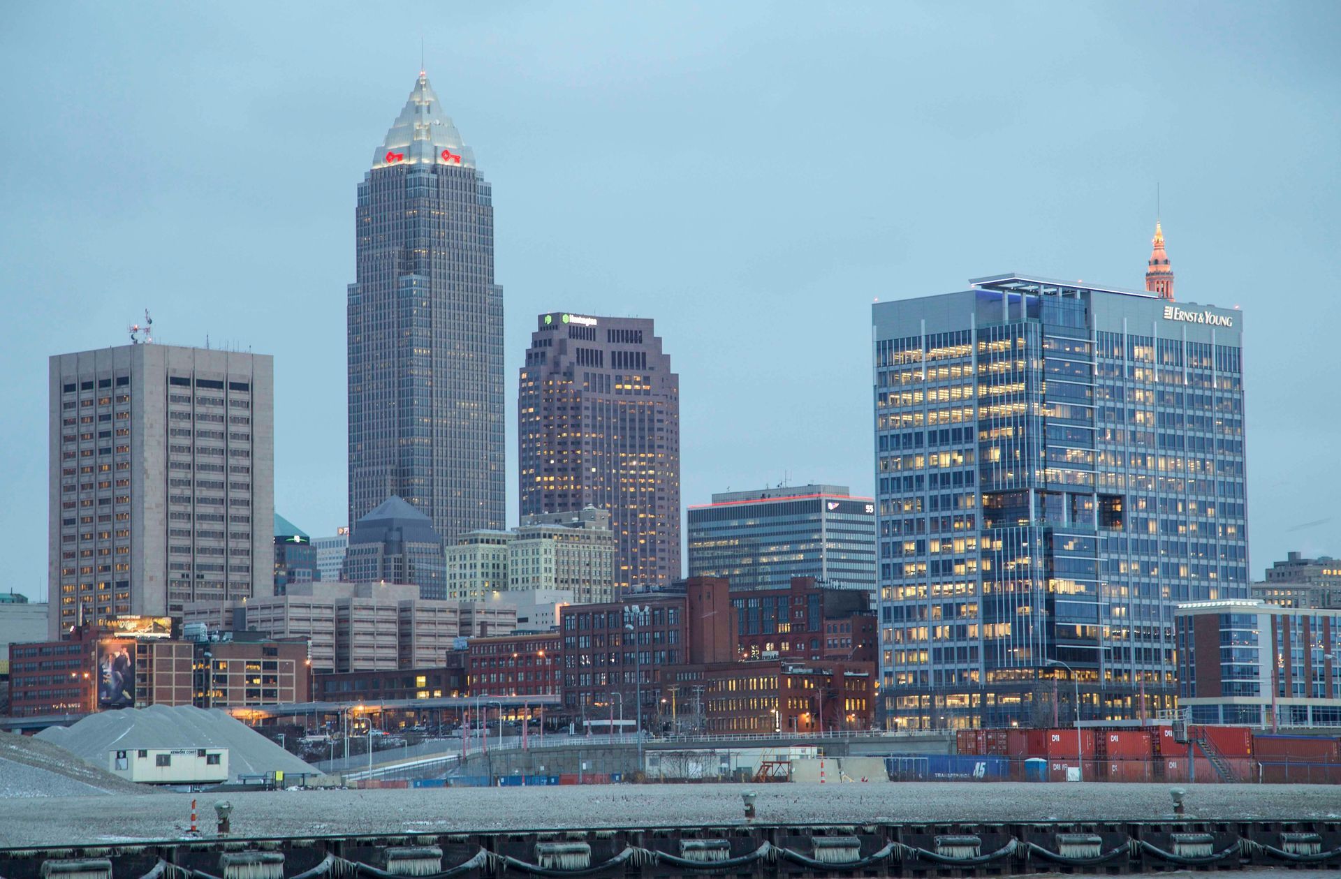 A view of a city skyline with a few buildings lit up