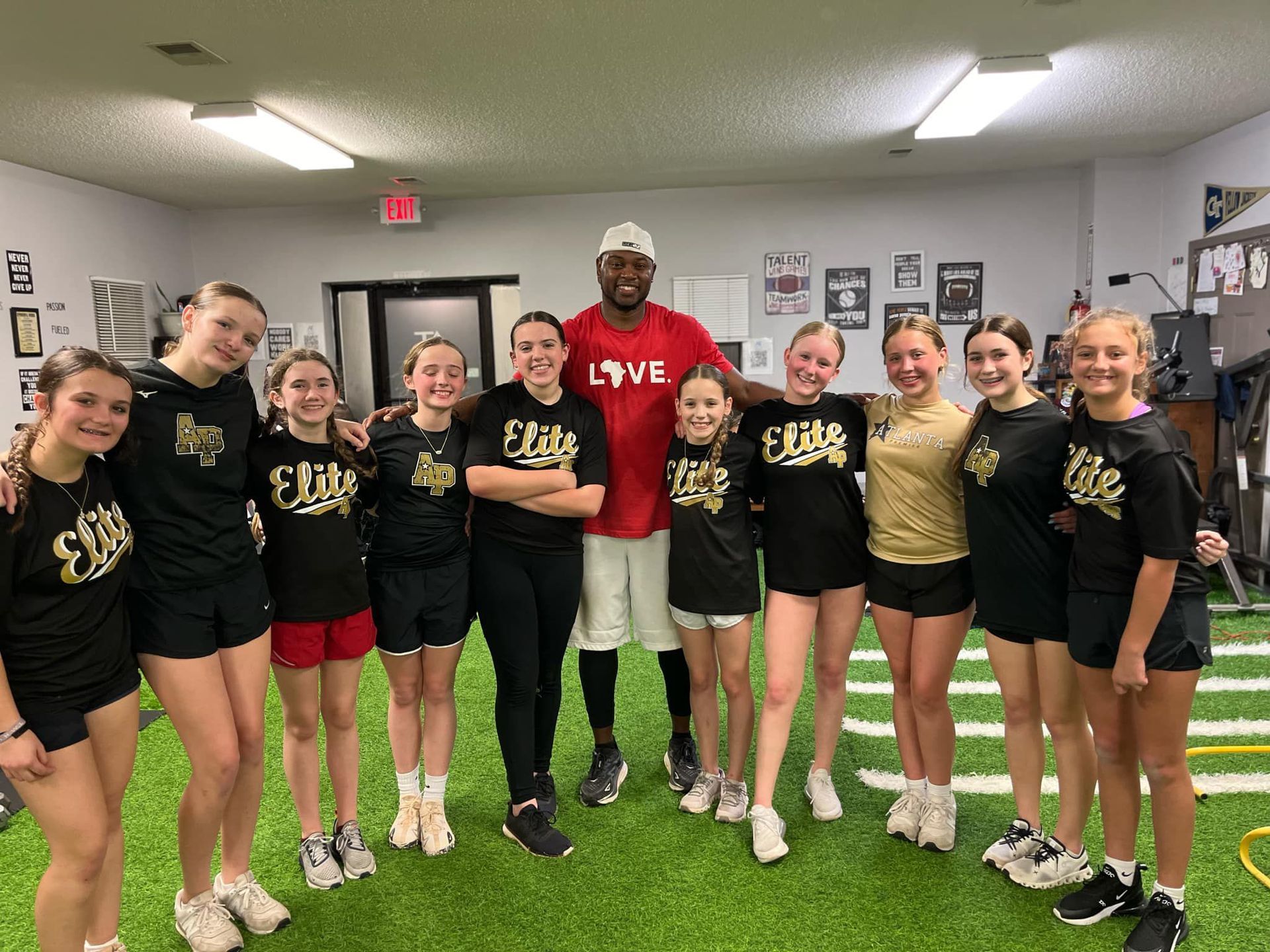 A smiling man in a red