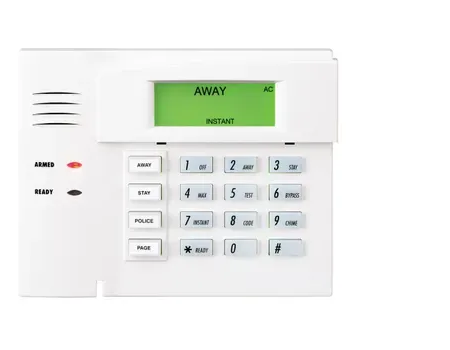 White security system keypad with a green 