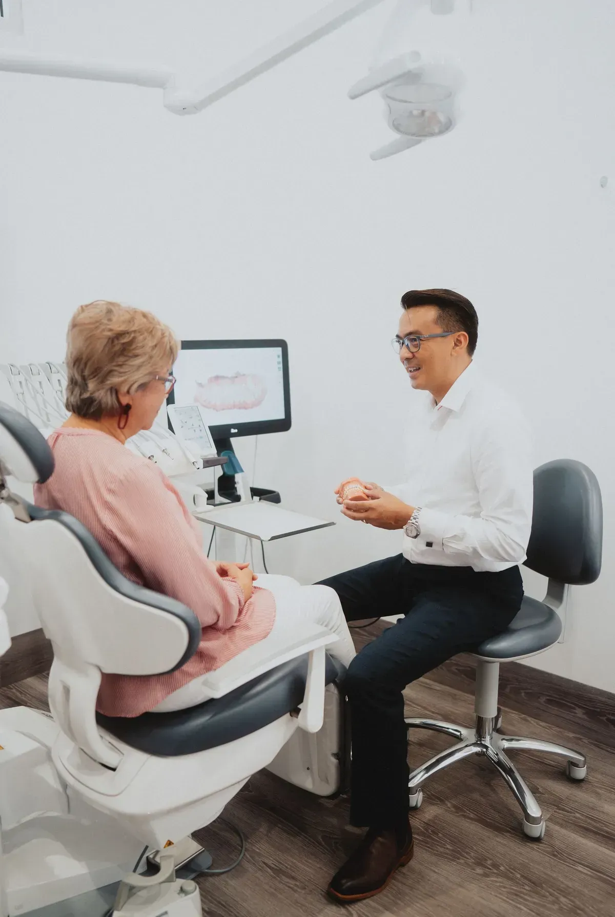 Dentist Explaining Dental Model to Patient — New Leaf Dentists In Erina, NSW