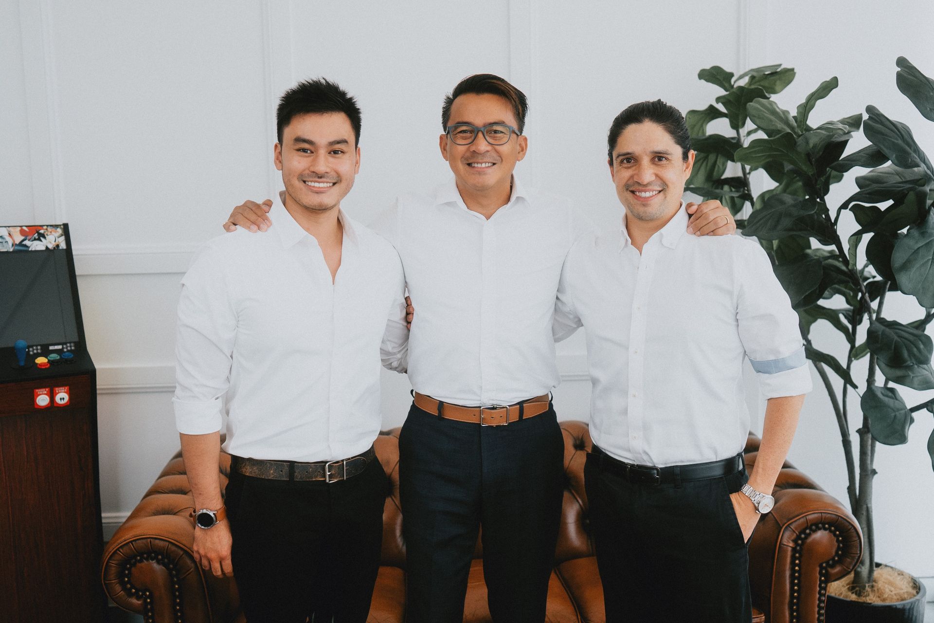 Three People in White Button-down Shirts Stand Side-by-side Smiling — New Leaf Dentists In Erina, NSW