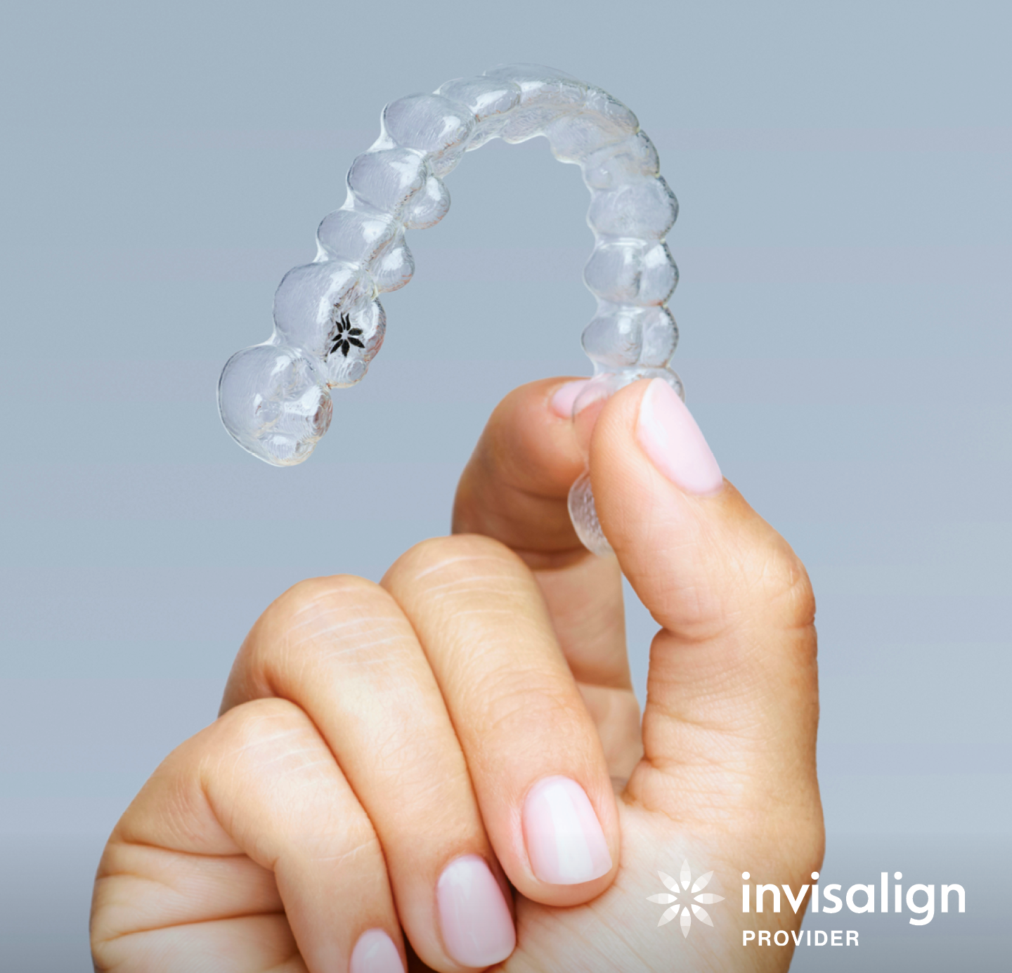 Person Holding a Clear Invisalign Aligner — New Leaf Dentists In Erina, NSW