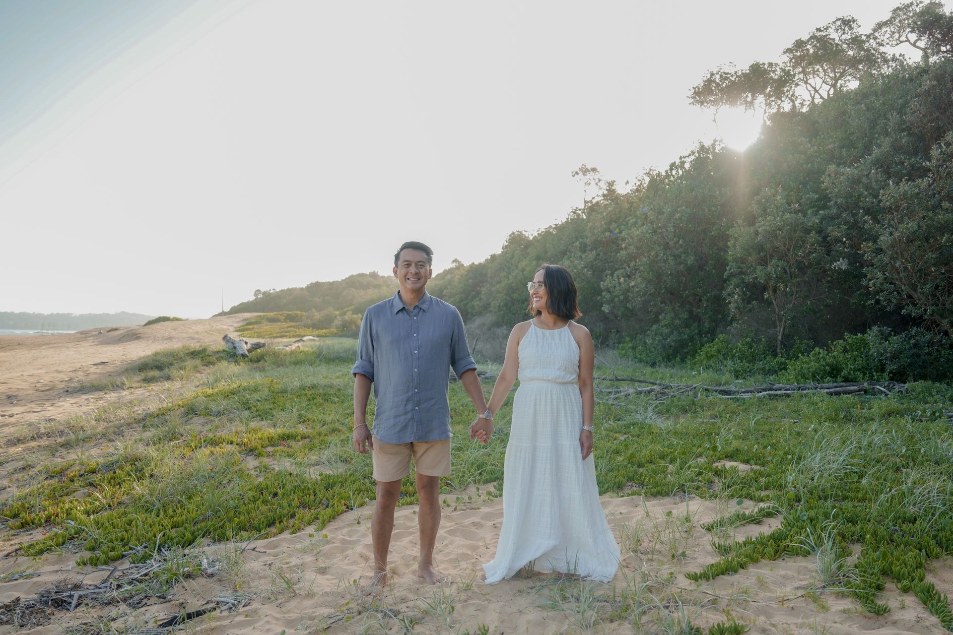 Couple Holding Hands, Smiling at Each Other — New Leaf Dentists In Erina, NSW