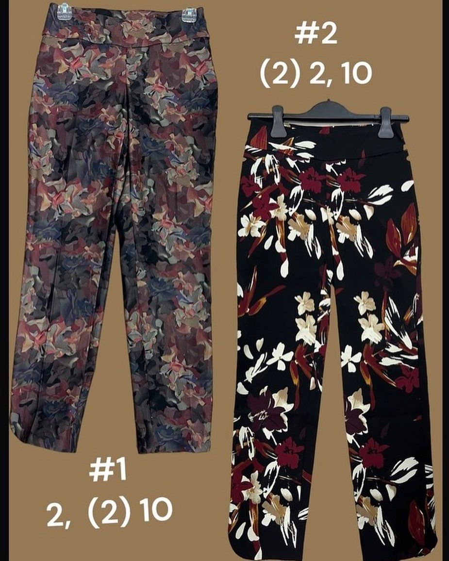 Two pairs of floral pants, brown and black. Sizing labels: #1 (2)10, #2 (2)2,10.