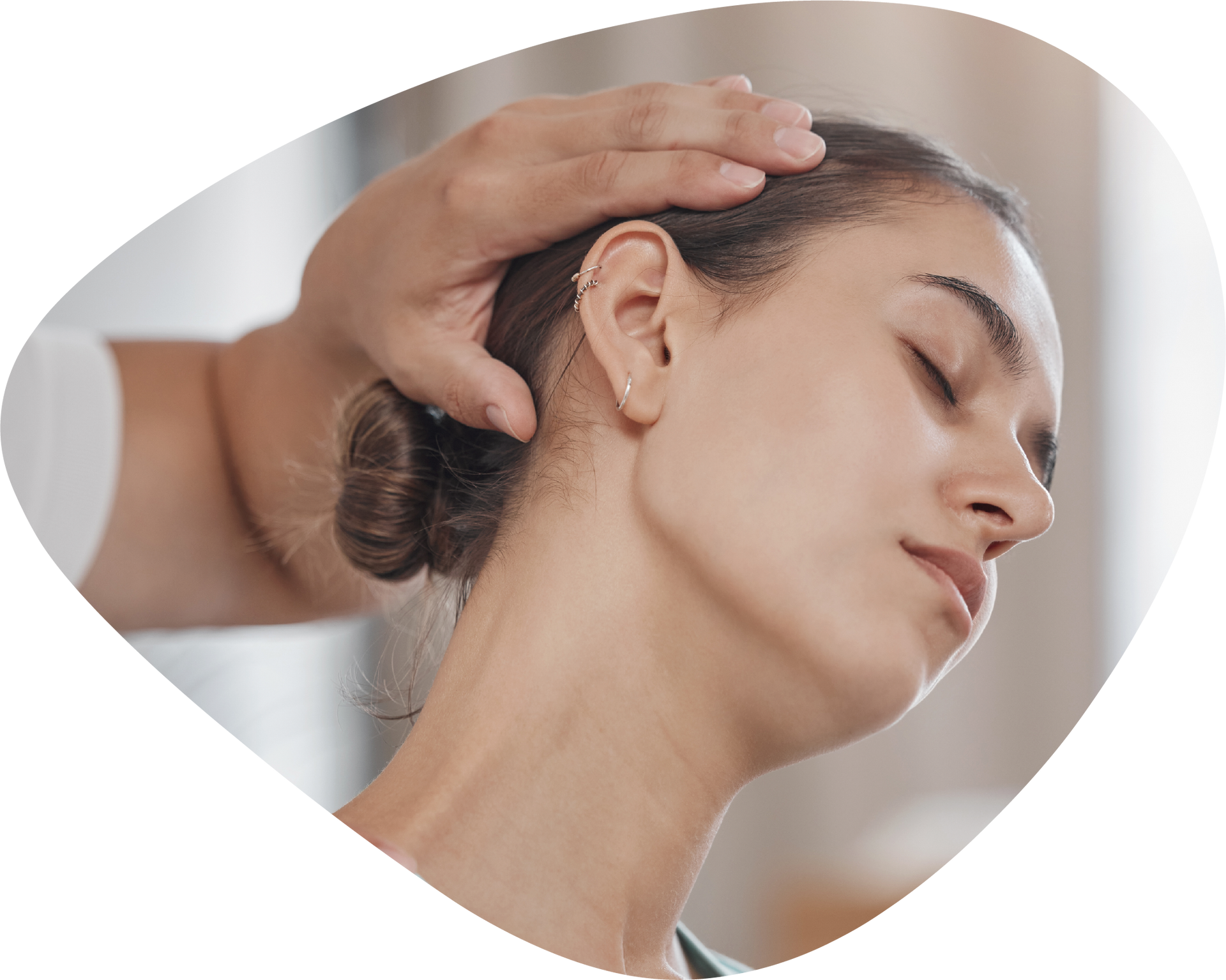 A woman is getting a head massage from a person.