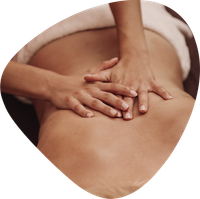 A person is getting a massage with their hands on their back.