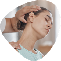 A woman is getting a massage on her neck.