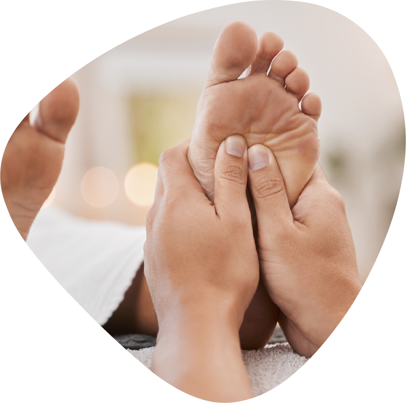 A person is getting a massage with their hands on their back.