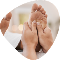 A person is getting a massage with their hands on their back.
