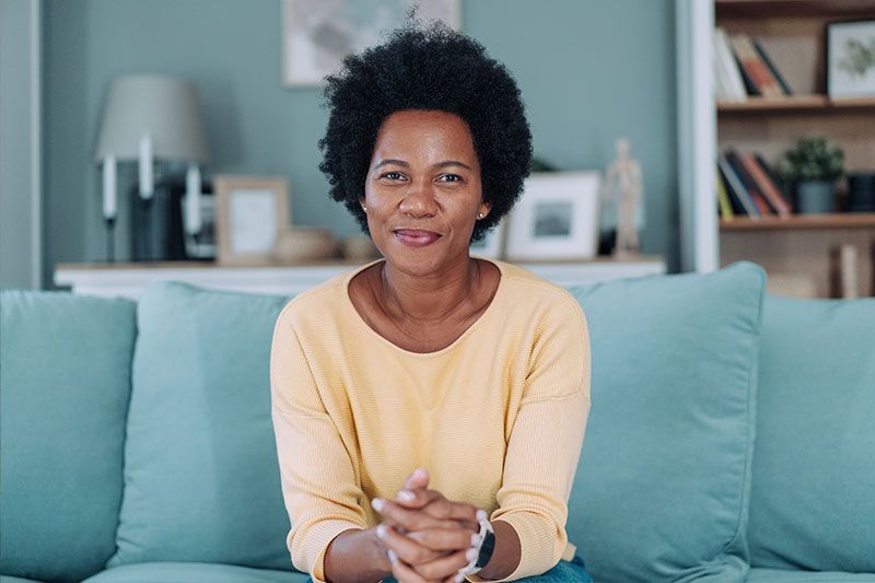 A woman who knows the truth about caregiving smiles confidently as she reaps the many benefits it pr