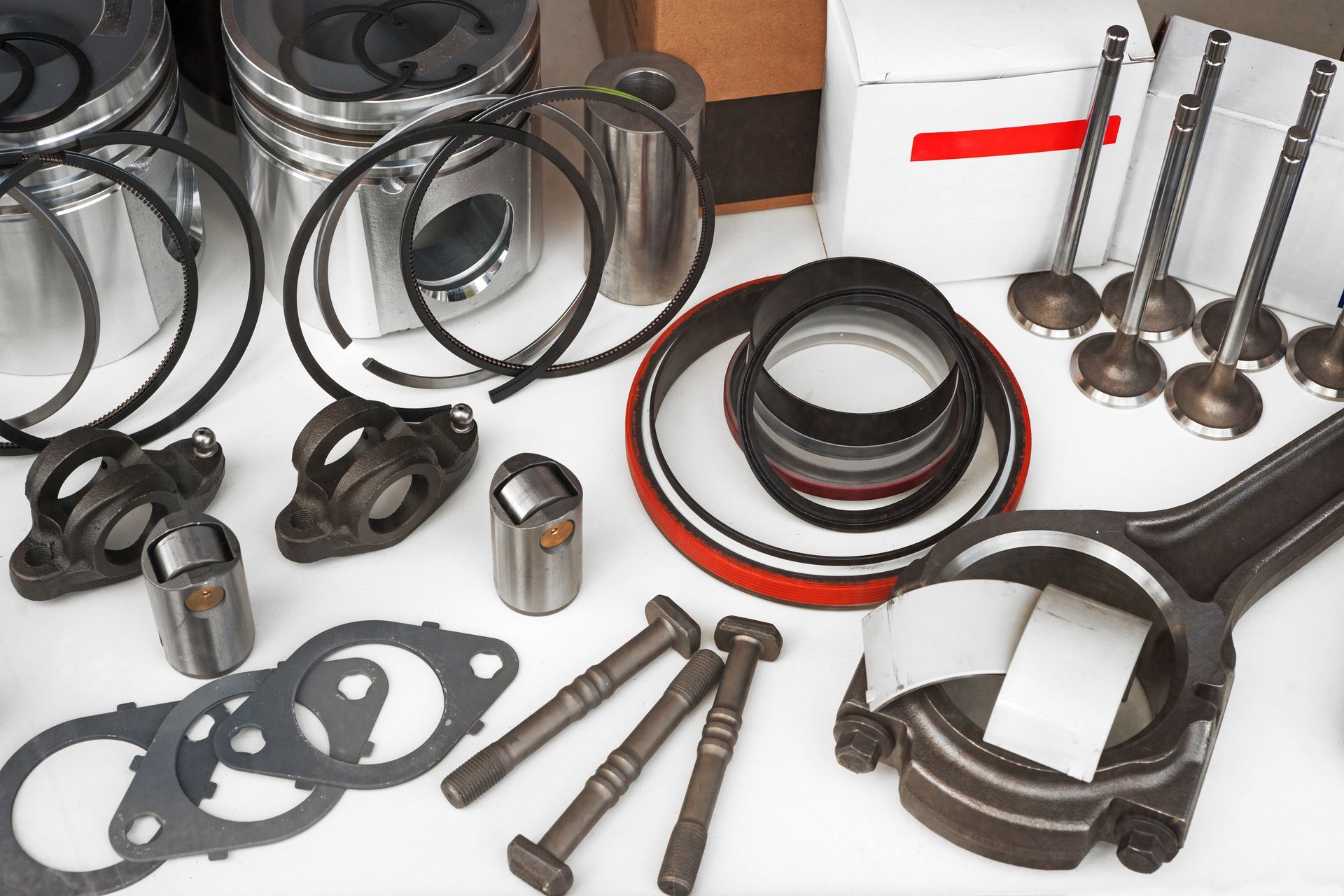 Heavy-duty truck parts and accessories including engine, suspension, and brake components displayed.