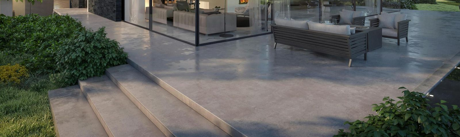 A yellow excavator is sitting on top of a pile of gravel.