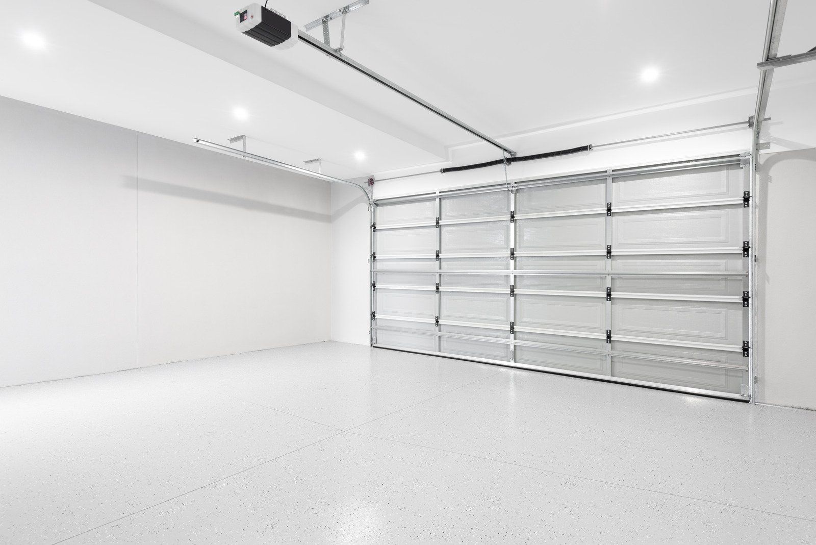 A yellow excavator is sitting on top of a pile of gravel.