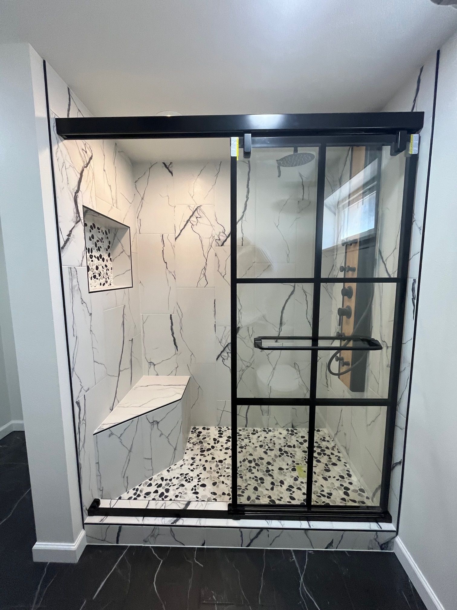 A bathroom with a toilet, sink, bathtub and shower.